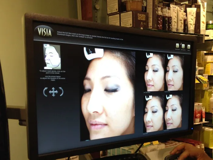 A facial imaging system displaying skin-analysis views of a face
