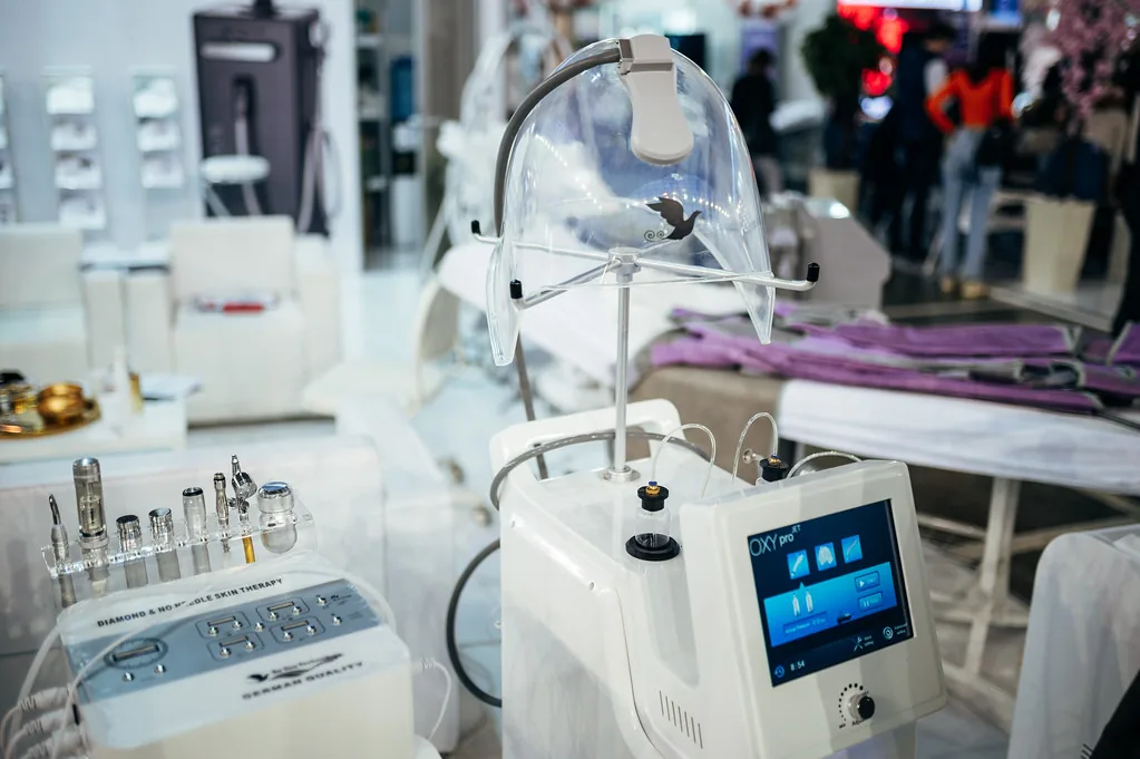 A hydro-dermabrasion facial machine with handpieces